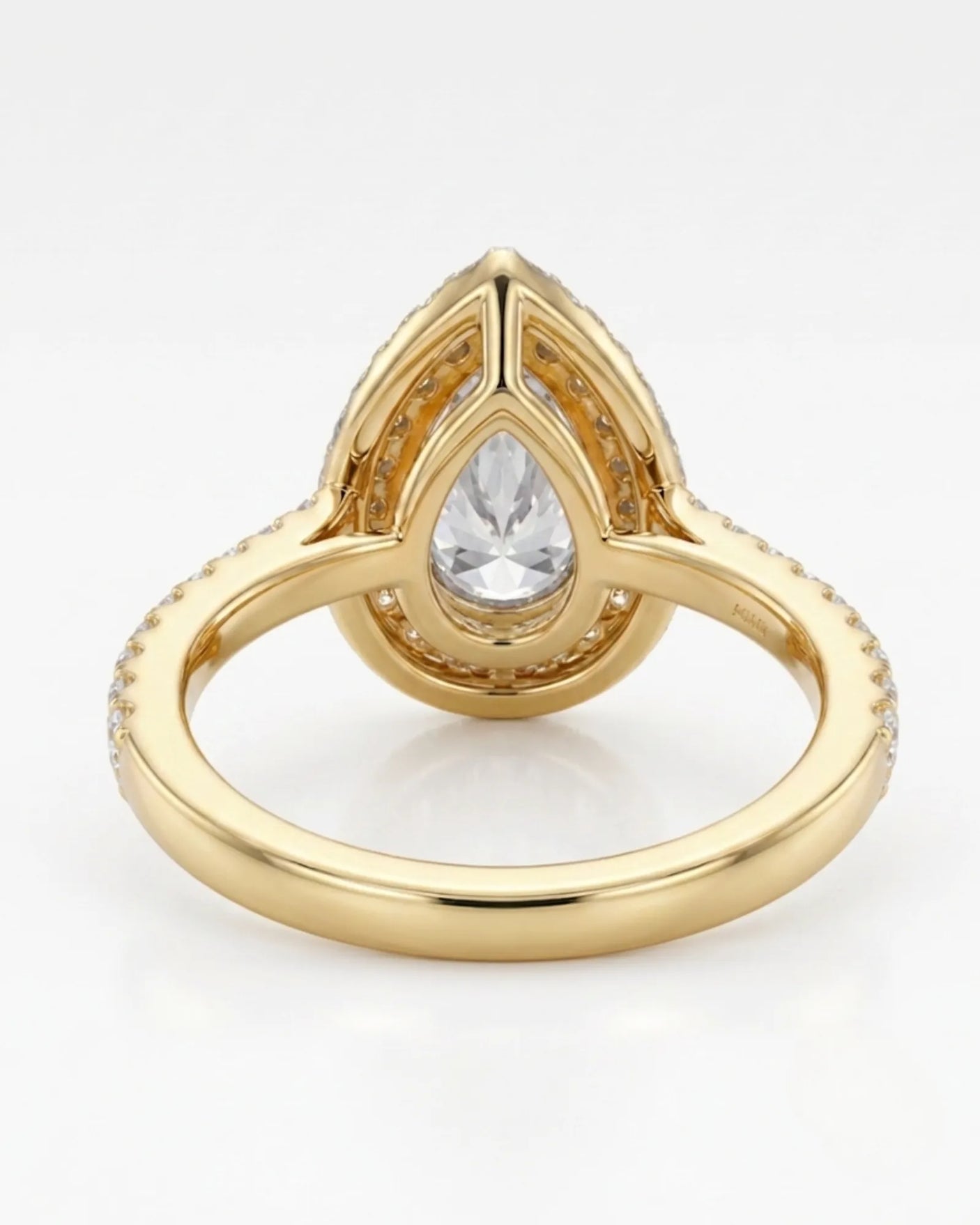 Romantic pear halo moissanite proposal ring with a slender pavé band in 18K yellow gold | SARATTI
