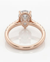 Romantic pear moissanite engagement ring with brilliant side stones for proposals in 18K rose gold | SARATTI