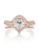 Romantic pear moissanite wedding set with curved bands for an individual rose gold engagement | SARATTI