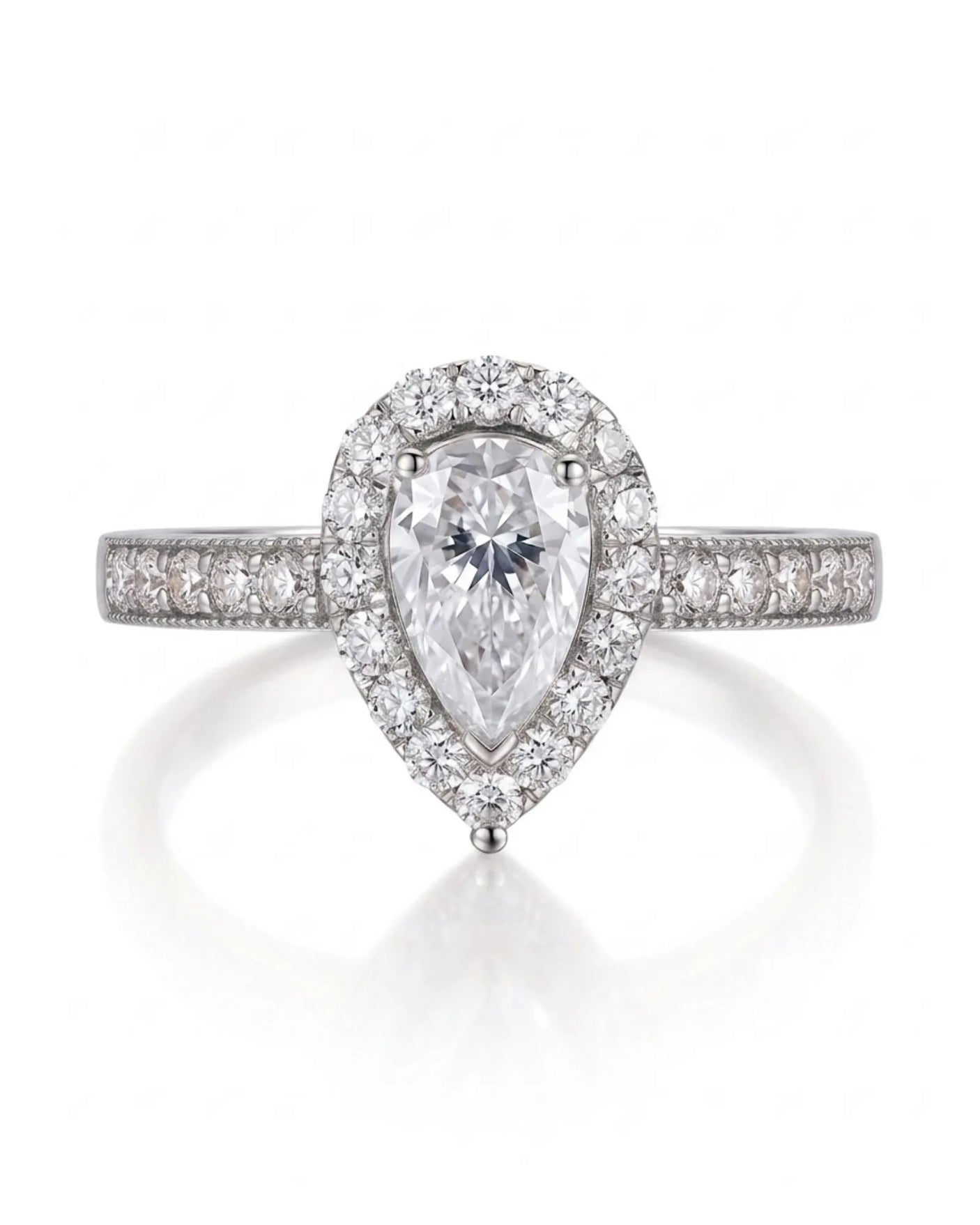 Romantic pear shaped moissanite ring with teardrop halo and pavé shoulders in platinum | SARATTI