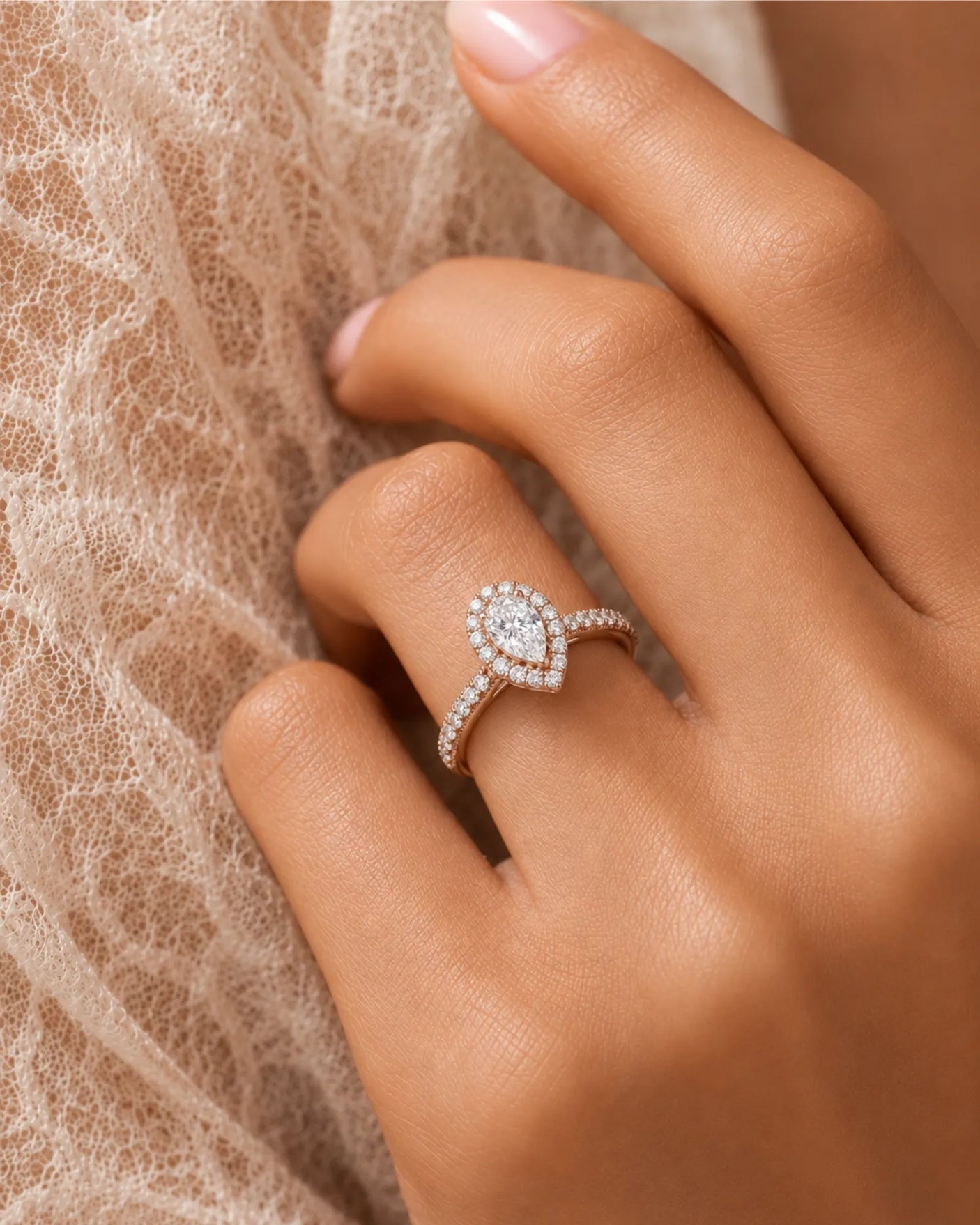 Romantic pear shaped moissanite ring with teardrop halo and pavé shoulders in rose gold | SARATTI