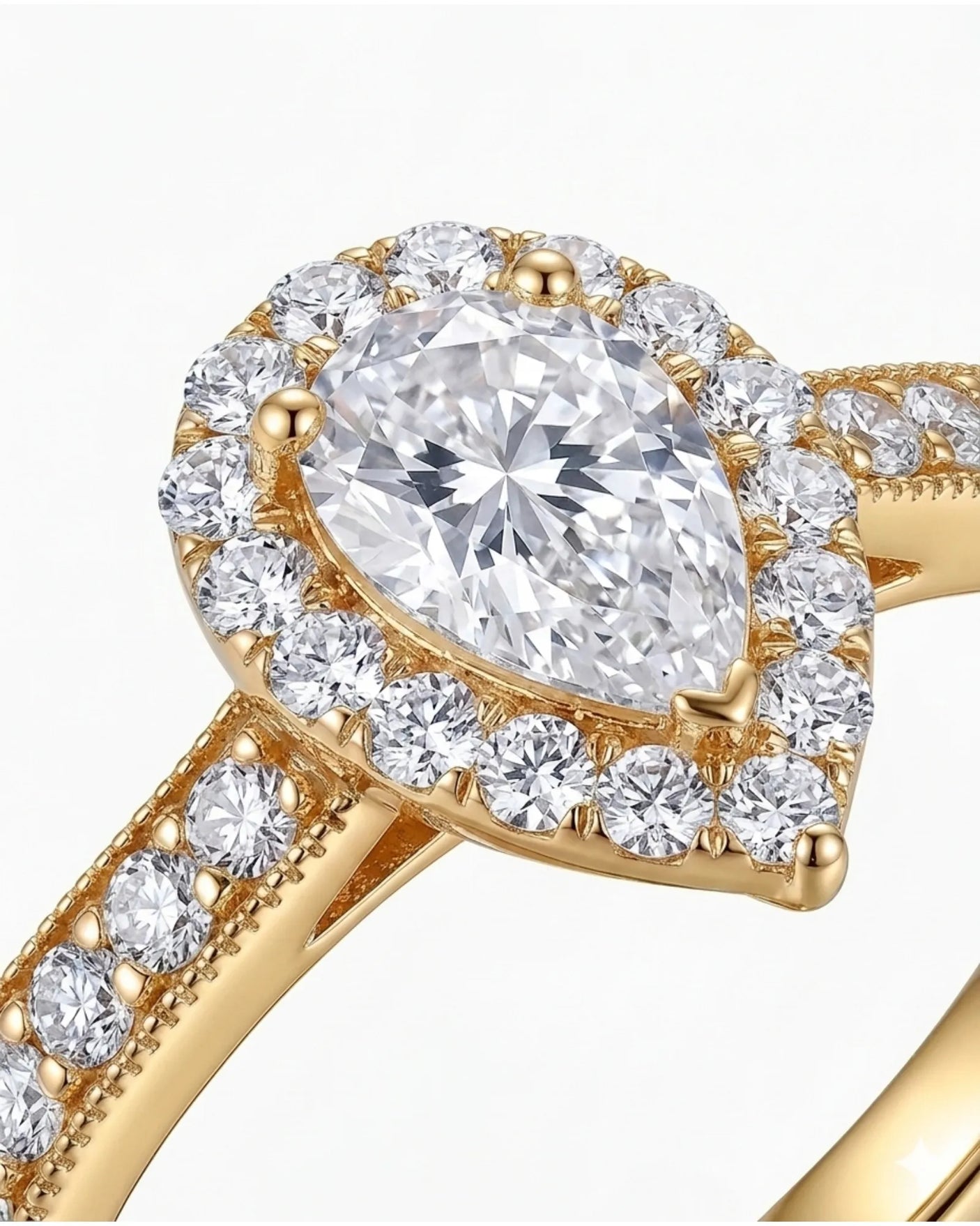 Romantic pear shaped moissanite ring with teardrop halo and pavé shoulders in yellow gold | SARATTI