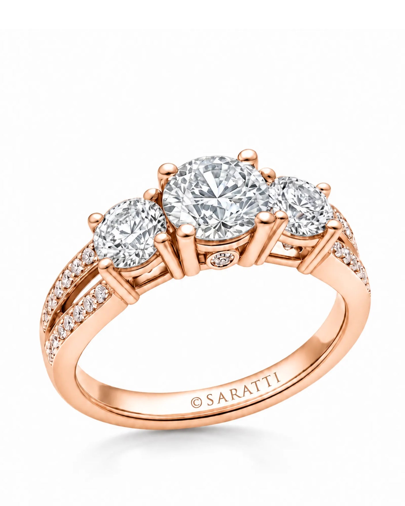 Romantic rose gold moissanite engagement ring with three round stones and split-shank pavé | SARATTI