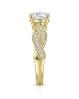Romantic round moissanite proposal ring with twisted shank crafted in rich 18K yellow gold | SARATTI