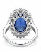 Romantic sapphire ring with delicate round diamond halo in polished platinum | SARATTI