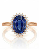 Romantic sapphire ring with delicate round diamond halo in soft rose gold | SARATTI