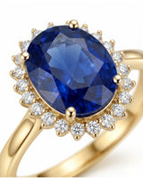 Romantic sapphire ring with delicate round diamond halo in warm yellow gold | SARATTI