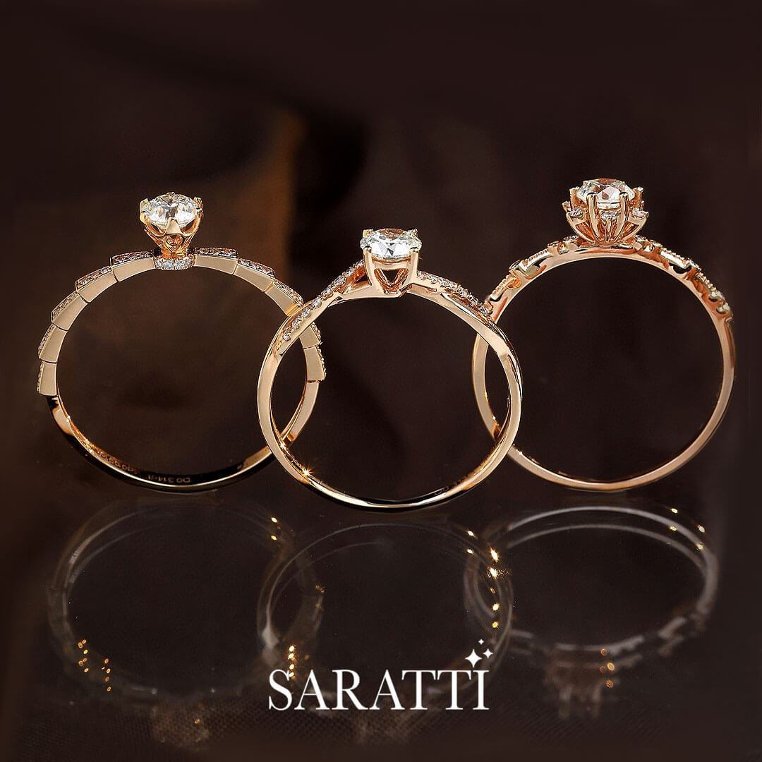 Upright angle of the Liaison Céleste Natural Diamond Engagement Ring in the middle of two other rings | Saratti Diamonds 