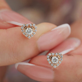 Gorgeous Pair of Rose Gold Diamond Halo Earrings in Model's Fingers  | Saratti | Custom High and Fine Jewelry