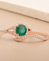Rose gold emerald engagement ring and matching curved band for a meaningful proposal | SARATTI.