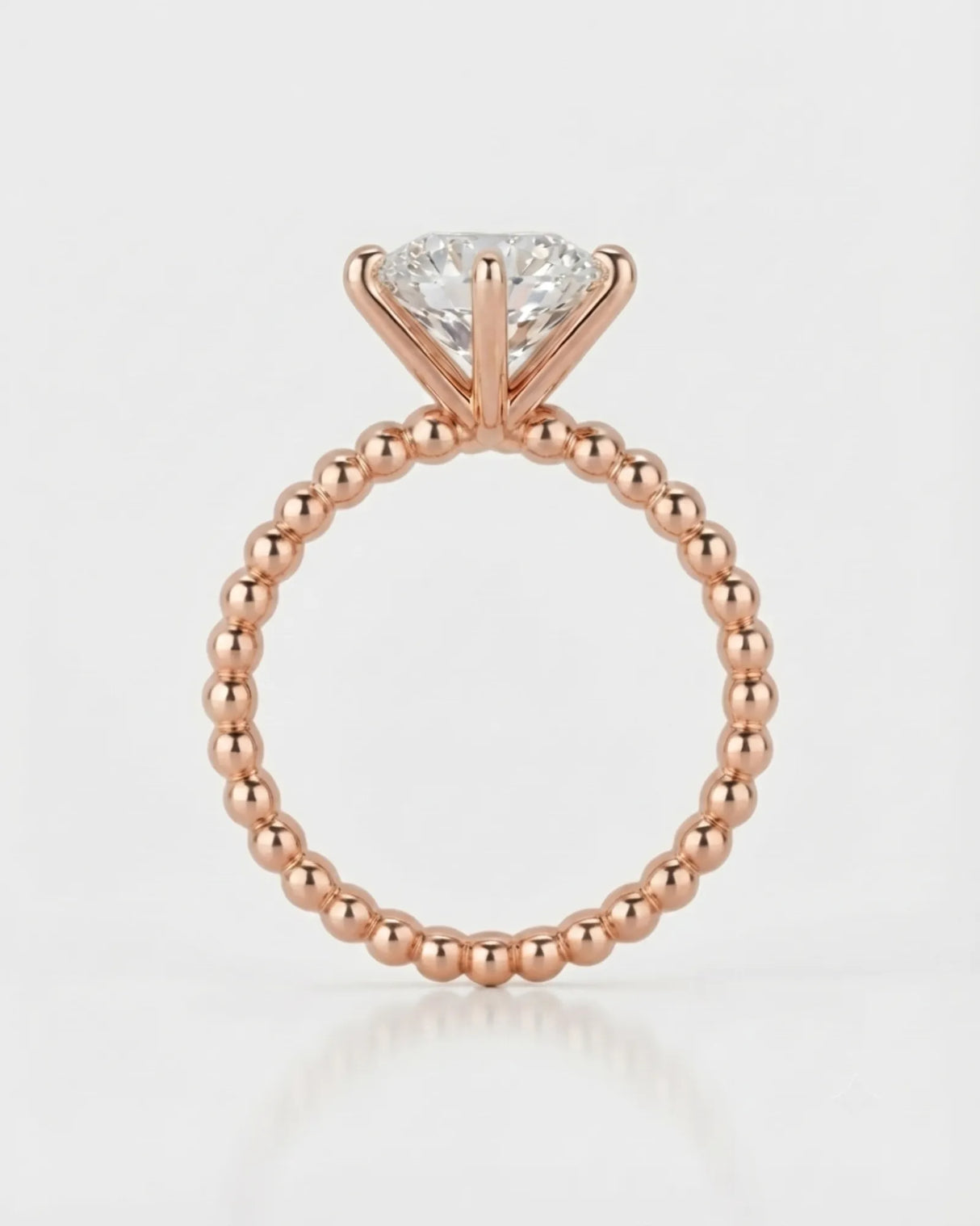Rose gold moissanite engagement ring for a romantic proposal with distinctive beaded craftsmanship | SARATTI