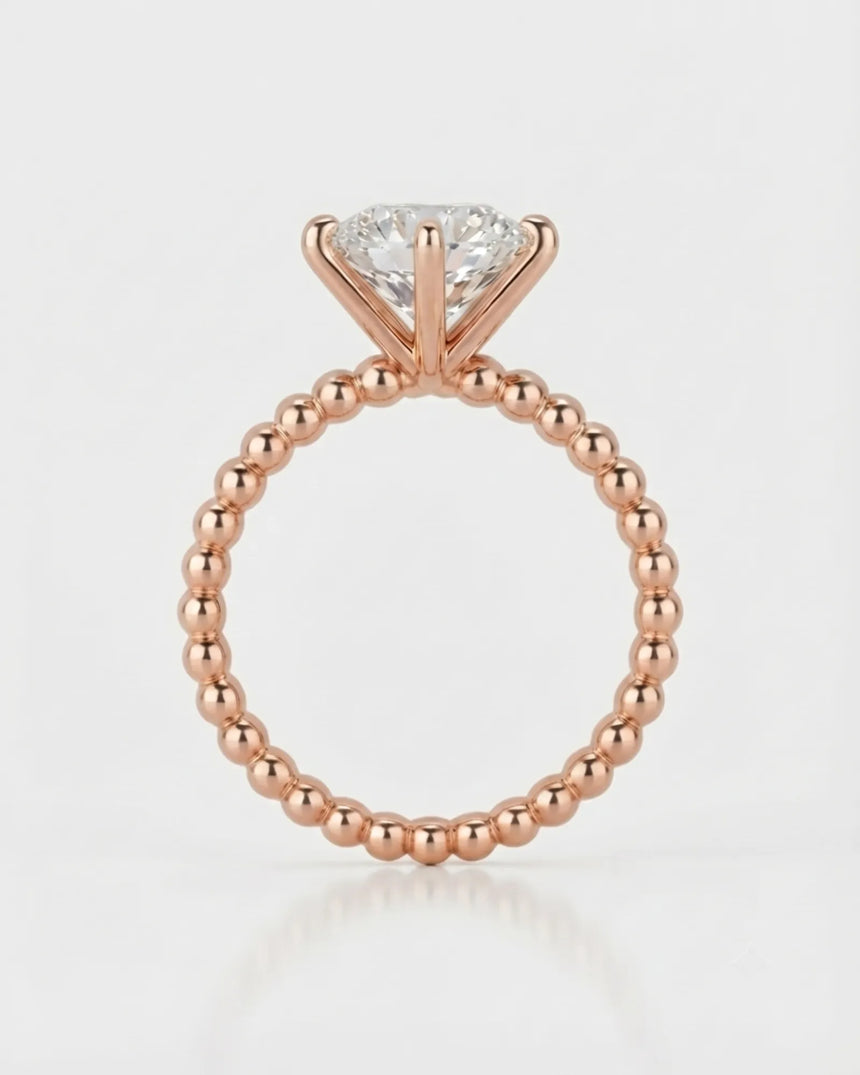 Rose gold moissanite engagement ring for a romantic proposal with distinctive beaded craftsmanship | SARATTI