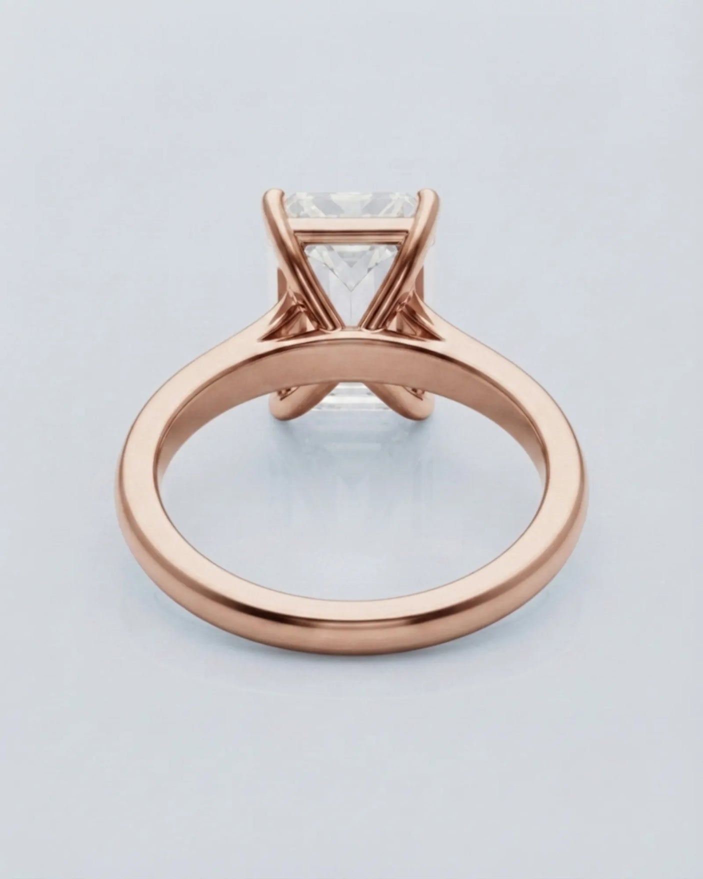Rose gold moissanite engagement ring for an elegant proposal with timeless emerald-cut sophistication | SARATTI