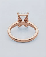 Rose gold moissanite engagement ring for an elegant proposal with timeless emerald-cut sophistication | SARATTI
