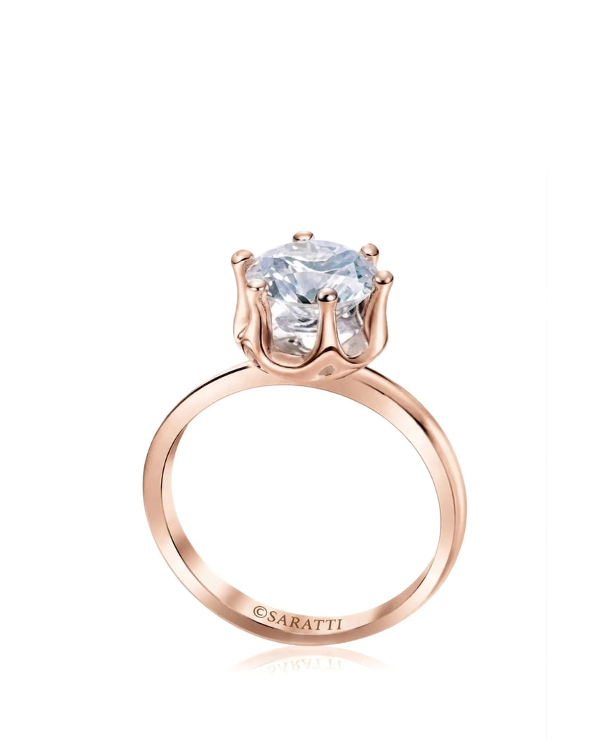 Rose gold moissanite engagement ring with round center stone and sculpted six-prong solitaire setting | SARATTI