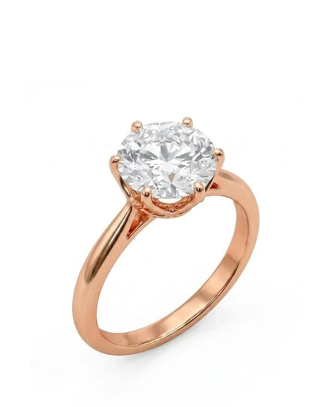 Rose gold moissanite engagement ring with round center stone and six-prong solitaire setting | SARATTI