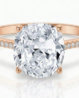 Rose gold moissanite ring with cushion center and refined pavé shoulders | SARATTI