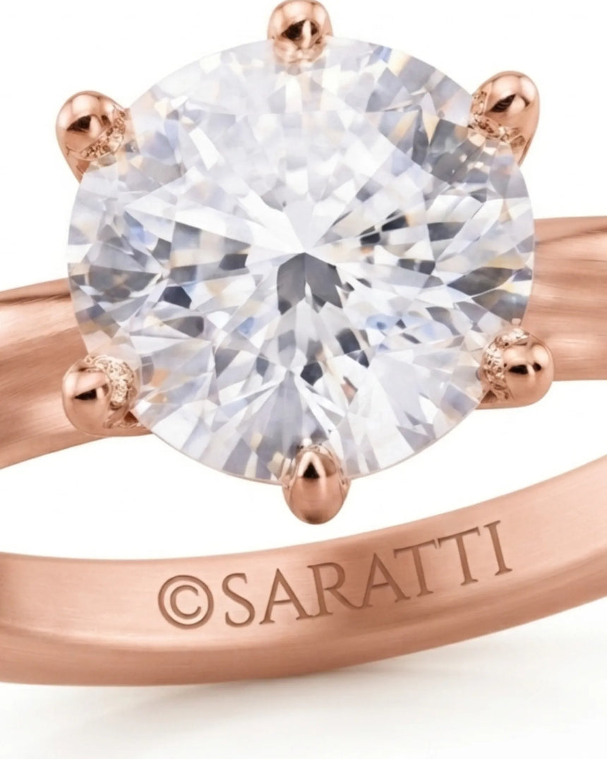 Rose gold round moissanite engagement ring for an elegant and romantic proposal | SARATTI.