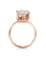 Rose gold round moissanite engagement ring for an elegant and romantic proposal | SARATTI
