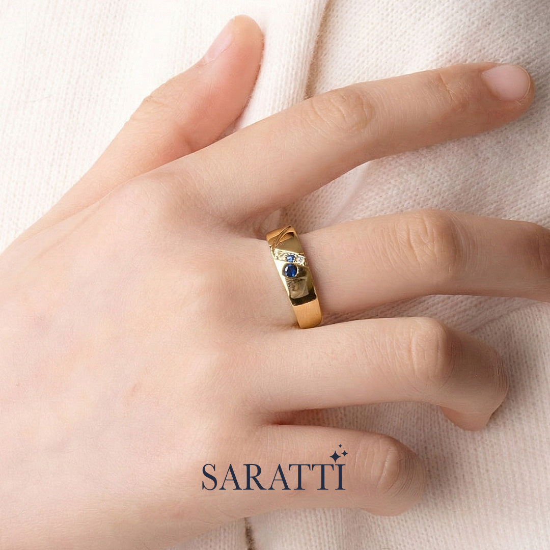6mm men diamond and sapphire three stone ring worn on hand in 18K yellow gold | SARATTI