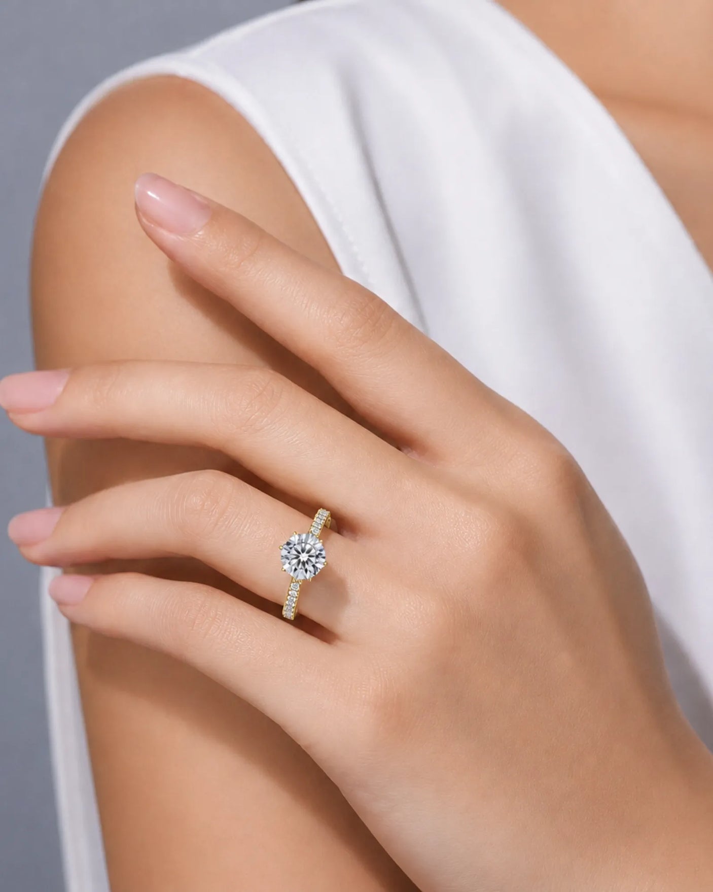 Round brilliant centre diamond ring with delicate pavé detailing in warm 18K yellow gold | SARATTI