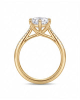 Round diamond engagement ring with six-prong center setting and pavé accents in 18K yellow gold | SARATTI