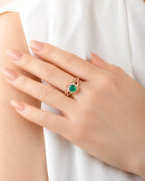 Round emerald bridal set in rose gold with colorless moissanite accents and open shoulders | SARATTI