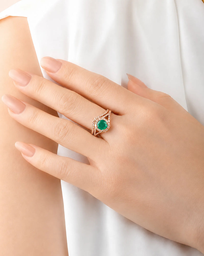 Round emerald bridal set in rose gold with colorless moissanite accents and open shoulders | SARATTI