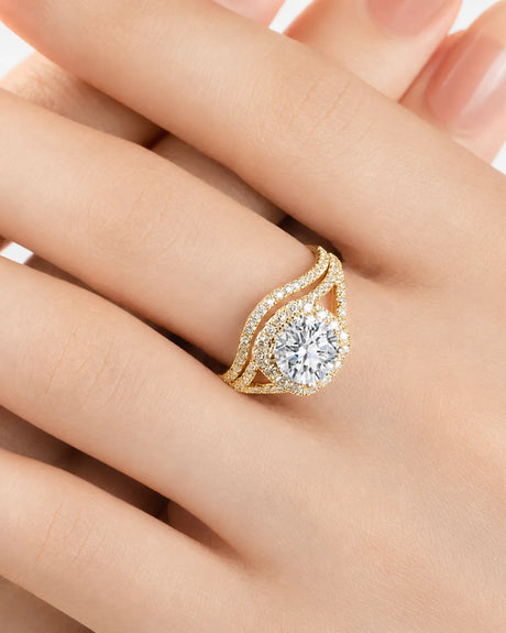 Round moissanite bridal set in yellow gold with halo engagement ring and matching curved wedding band | SARATTI