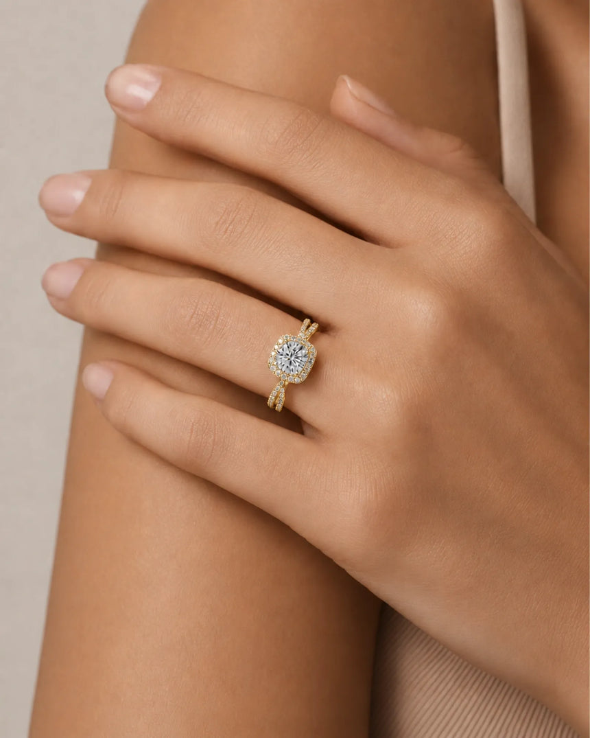 Round moissanite center stone ring with halo side stones in yellow gold | SARATTI