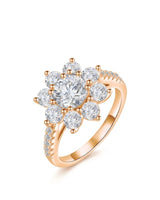 Round moissanite engagement ring with floral cluster halo and pavé shoulders in 18K rose gold | SARATTI