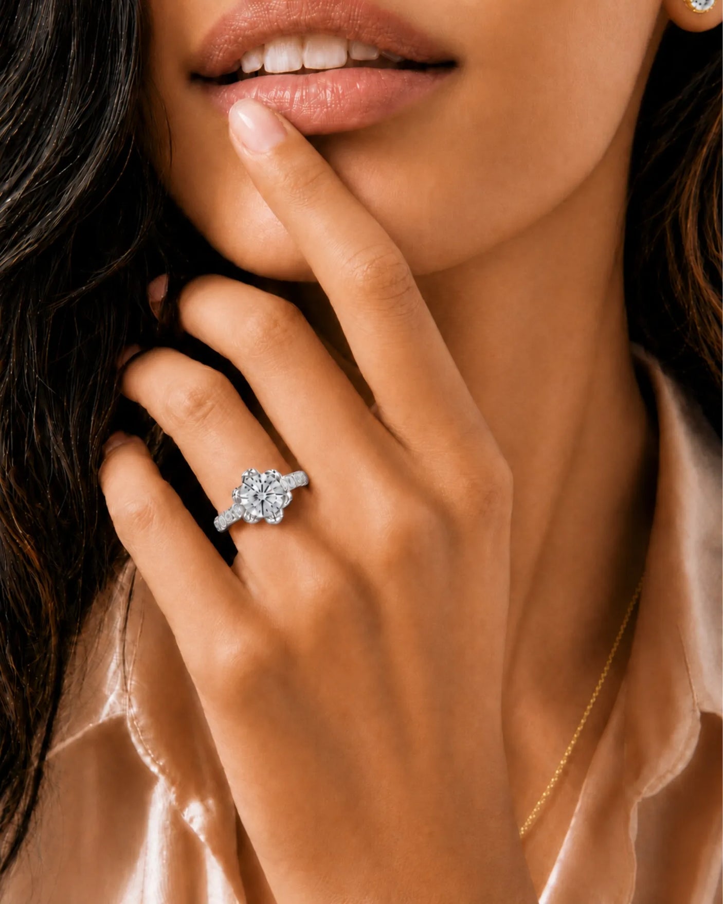 Round moissanite engagement ring with flower-inspired setting and pavé shoulders crafted in polished platinum | SARATTI