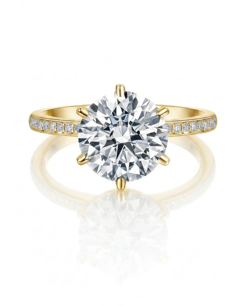 Round moissanite engagement ring with pavé band in warm yellow gold | SARATTI