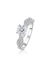 Round moissanite engagement ring with twisted pavé shoulders and enduring polished platinum setting | SARATTI