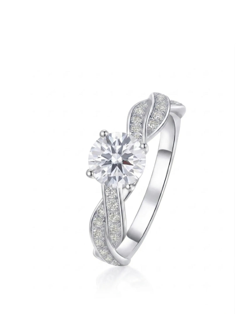 Round moissanite engagement ring with twisted pavé shoulders and enduring polished platinum setting | SARATTI