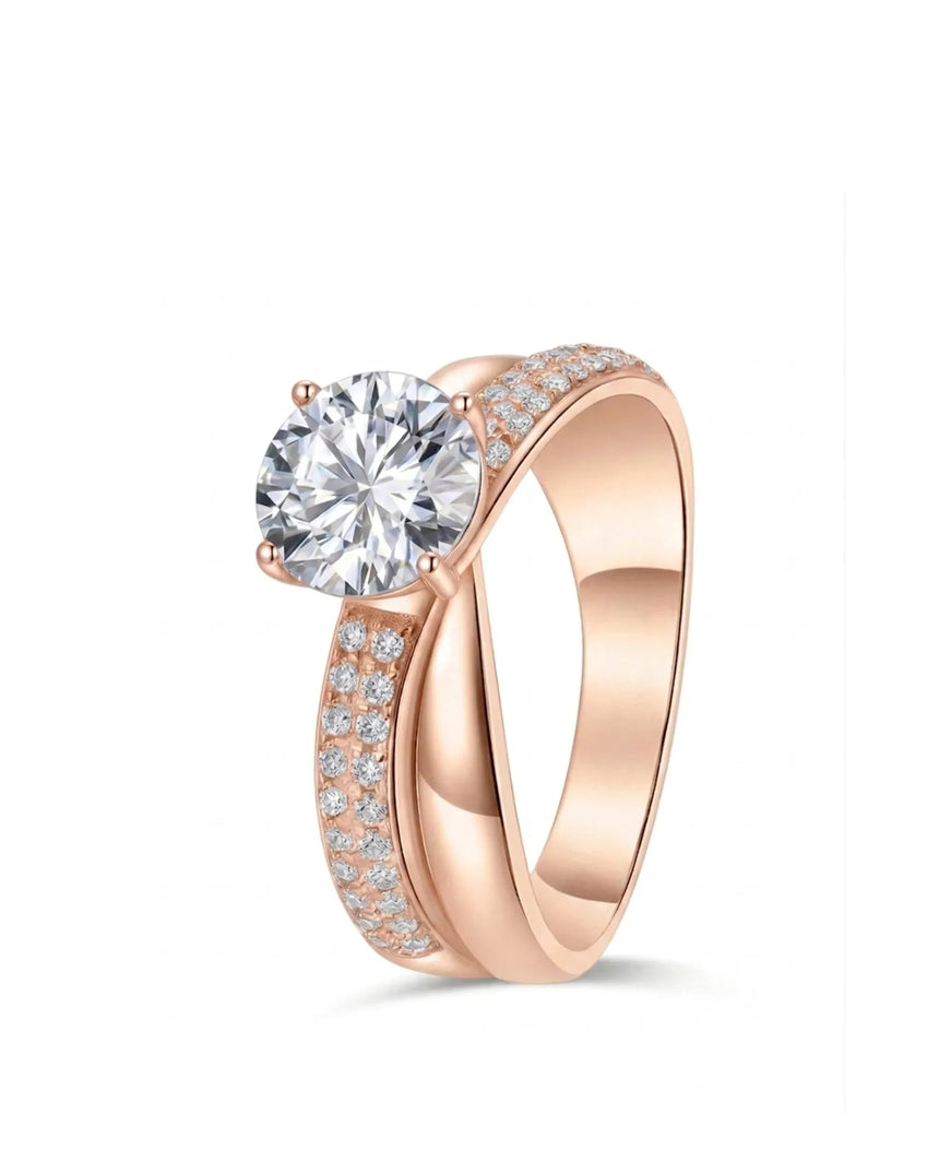 Round moissanite engagement ring with twisted split shank and pavé accents in 18K rose gold | SARATTI