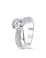 Round moissanite engagement ring with twisted split shank and pavé accents in 18K white gold | SARATTI
