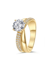 Round moissanite engagement ring with twisted split shank and pavé accents in 18K yellow gold | SARATTI