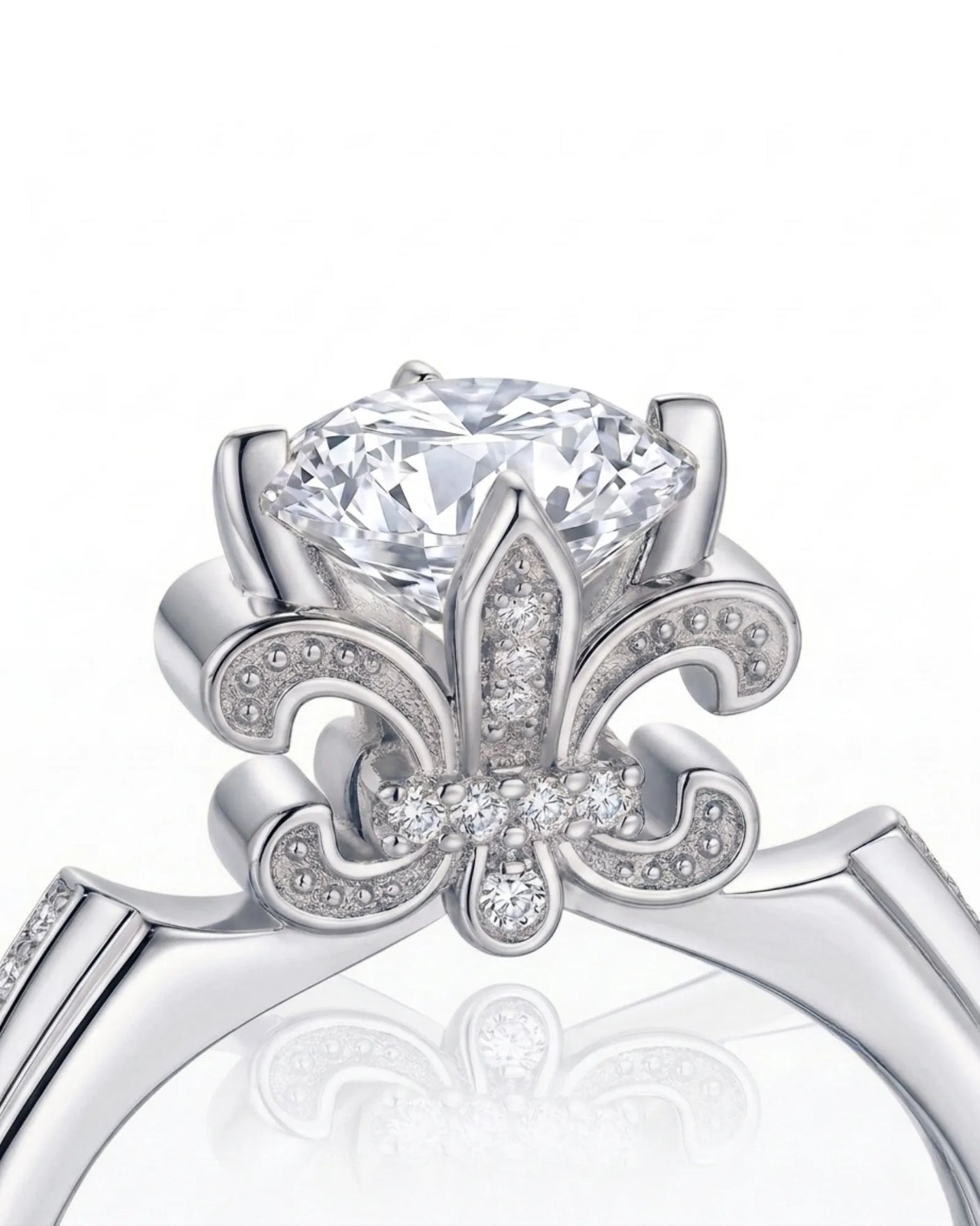 Round moissanite proposal ring with pavé side stones and symbolic fleur-de-lis setting in 18K white gold | SARATTI