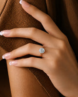 Round moissanite ring in rose gold with polished band and open gallery design | SARATTI