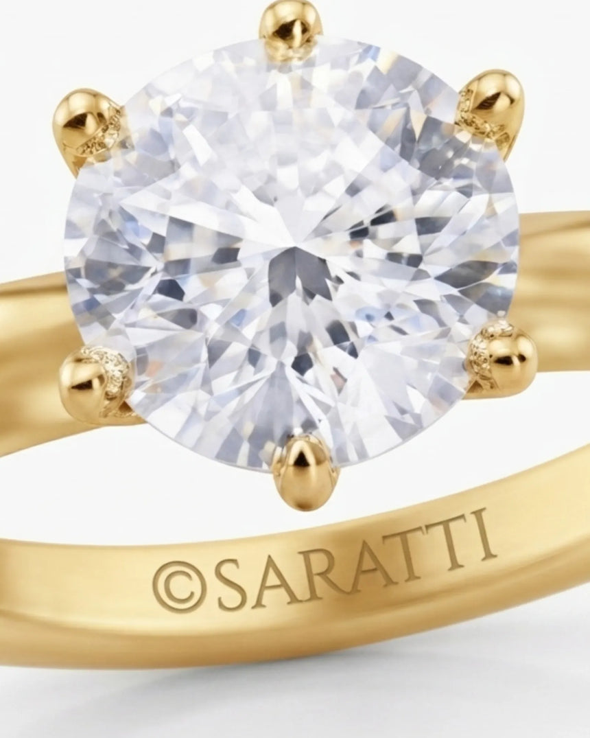 Round moissanite solitaire ring in 18K yellow gold with tulip-inspired crown and polished band | SARATTI