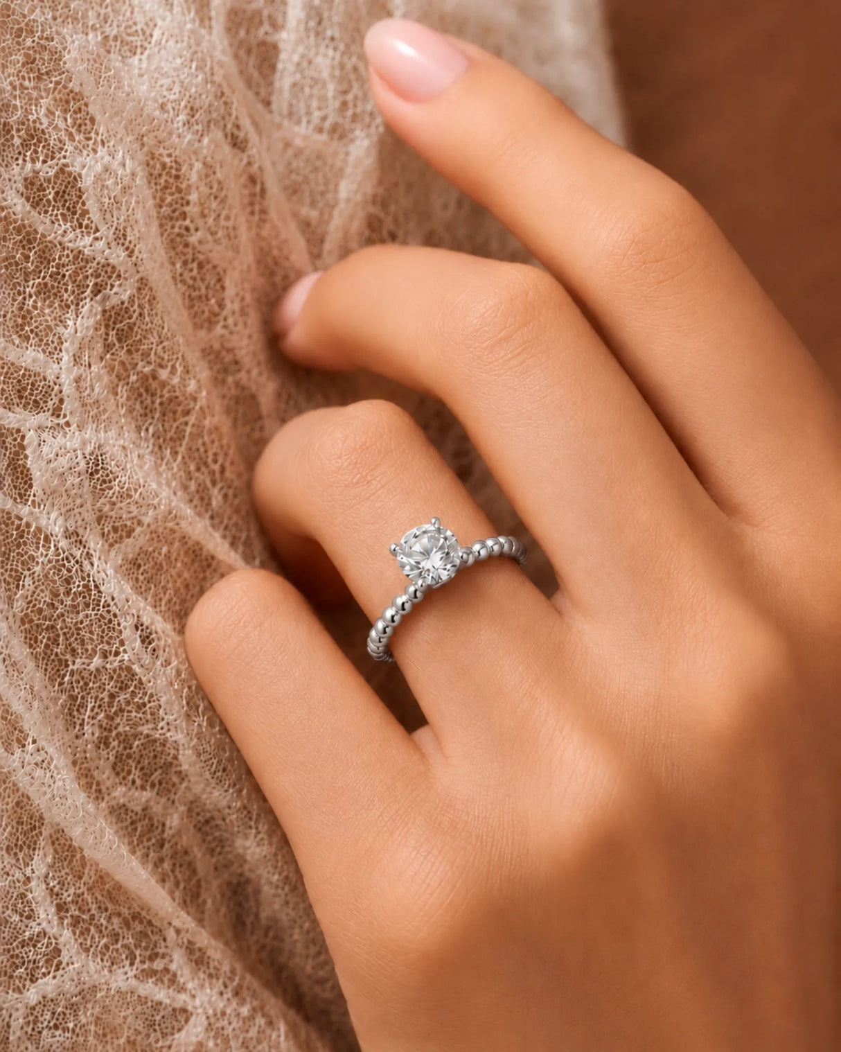 Round moissanite solitaire ring in platinum with sculptural bead-textured band and elevated basket | SARATTI