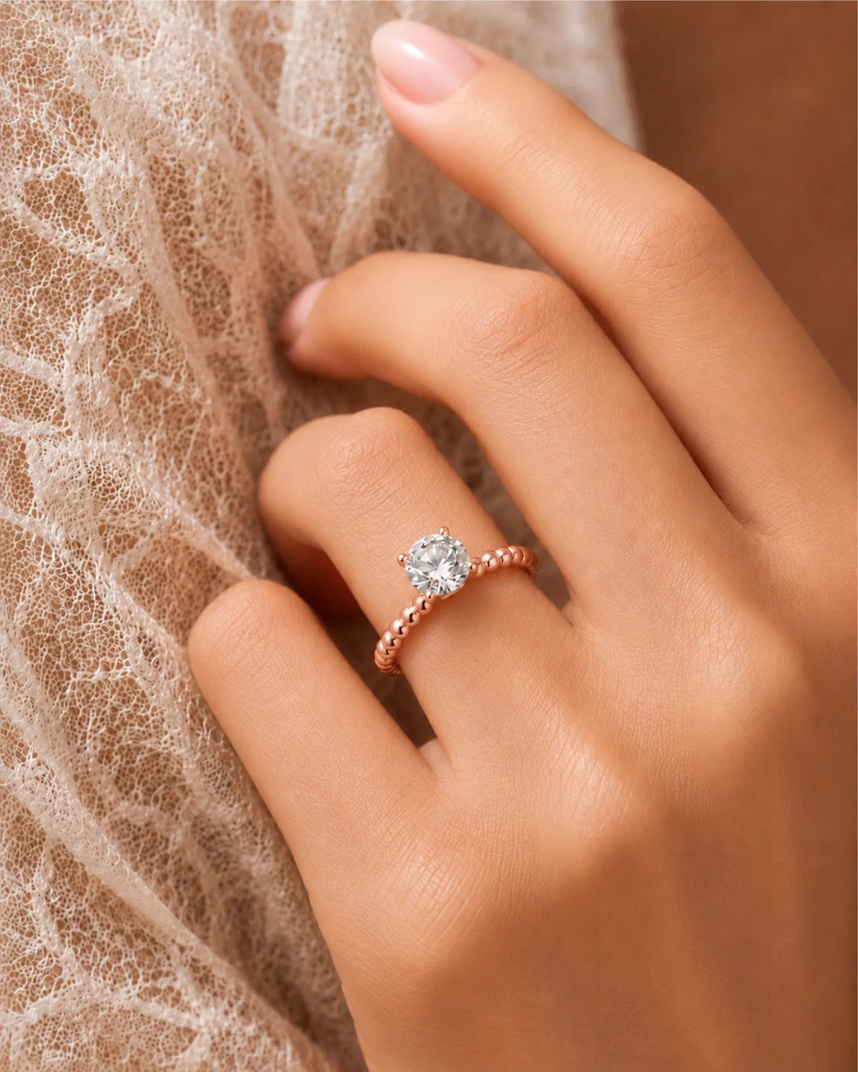 Round moissanite solitaire ring in rose gold with sculptural bead-textured band and elevated basket | SARATTI