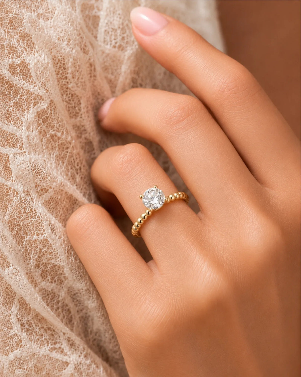 Round moissanite solitaire ring in yellow gold with sculptural bead-textured band and elevated basket | SARATTI