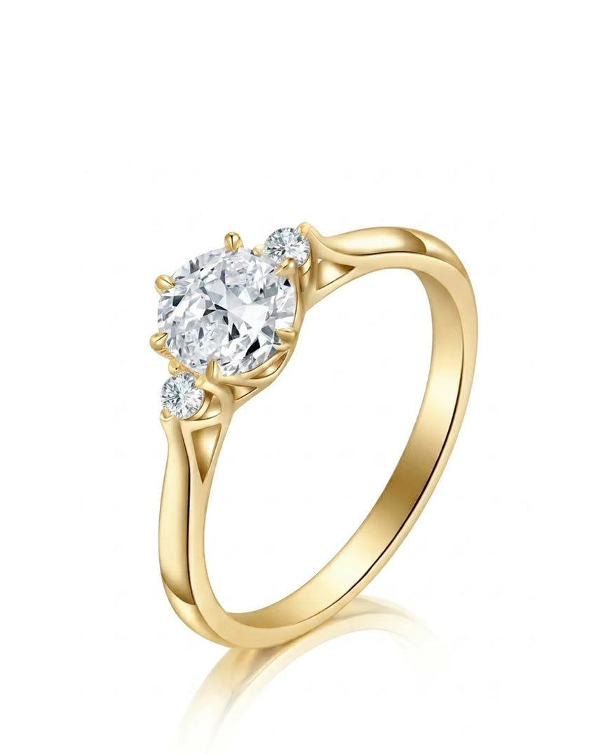 Round moissanite three stone engagement ring with sculptural yellow gold setting | SARATTI