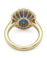 Round royal blue sapphire ring with floral diamond halo in 18K yellow gold - SARATTI