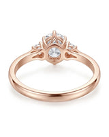 Round three stone moissanite engagement ring for a romantic proposal in rose gold | SARATTI