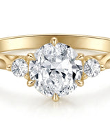 Round three stone moissanite engagement ring for a warm refined proposal in yellow gold | SARATTI