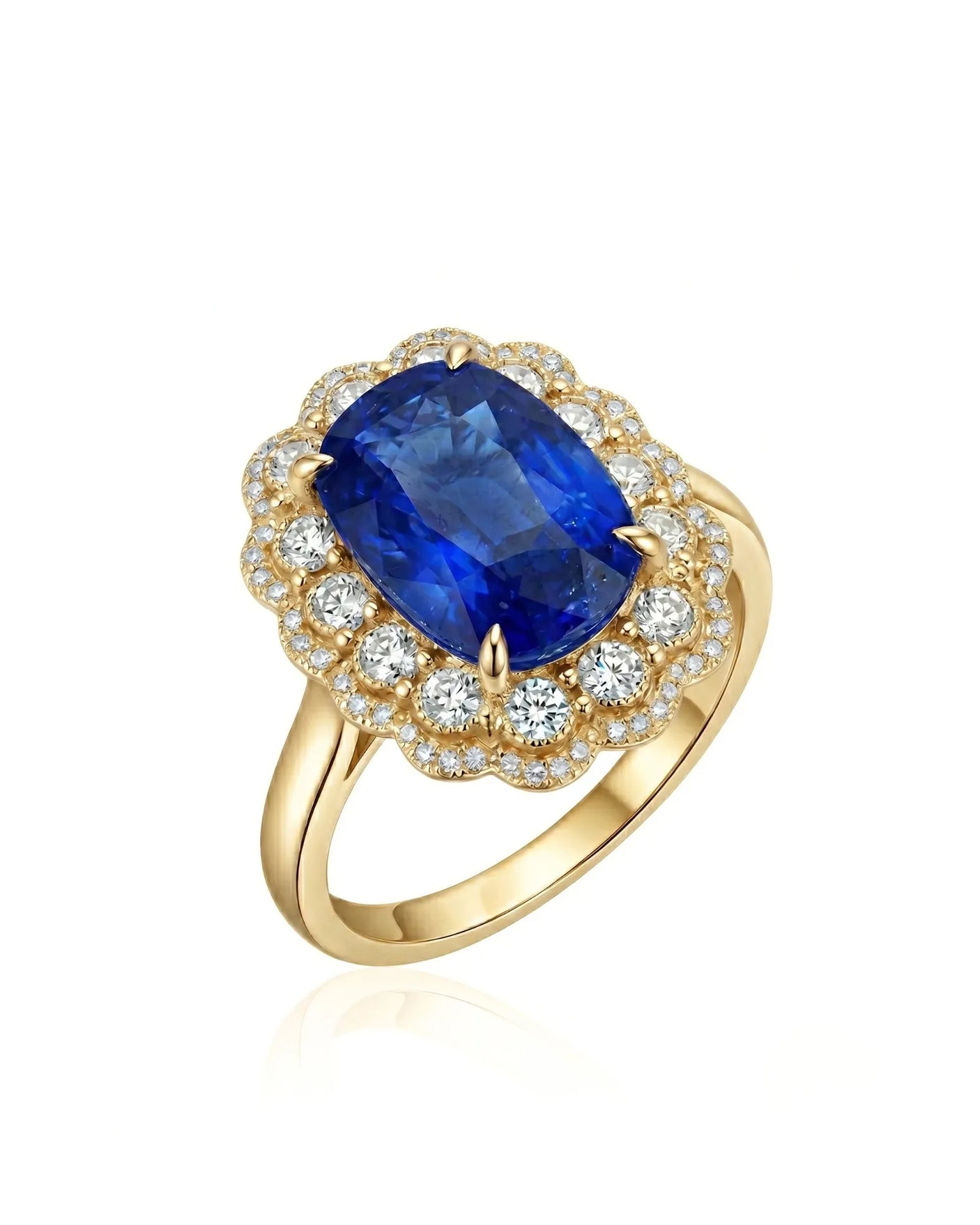 Royal blue cushion sapphire ring with scalloped diamond halo in 18K yellow gold | SARATTI