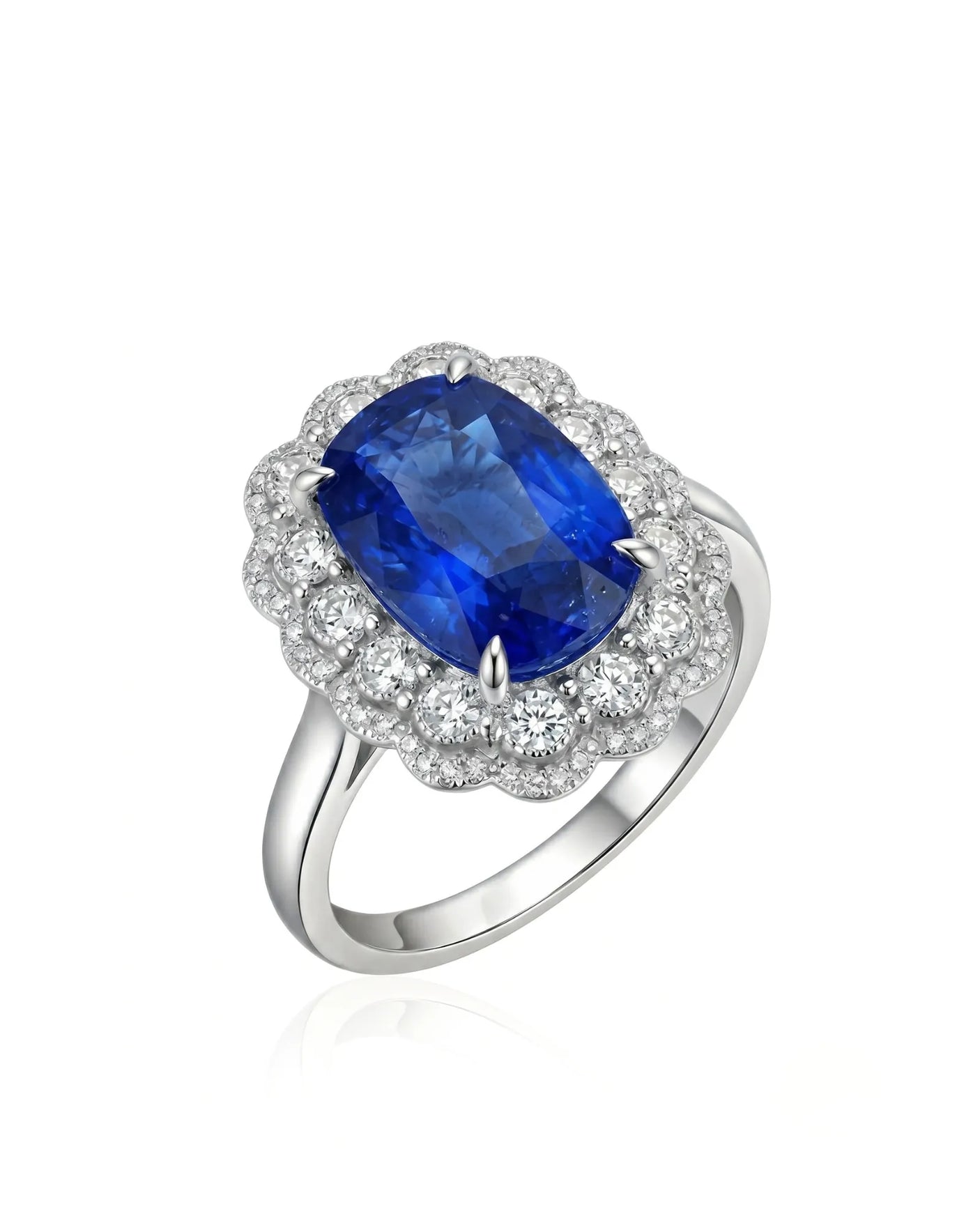 Royal blue cushion sapphire ring with scalloped diamond halo in platinum | SARATTI